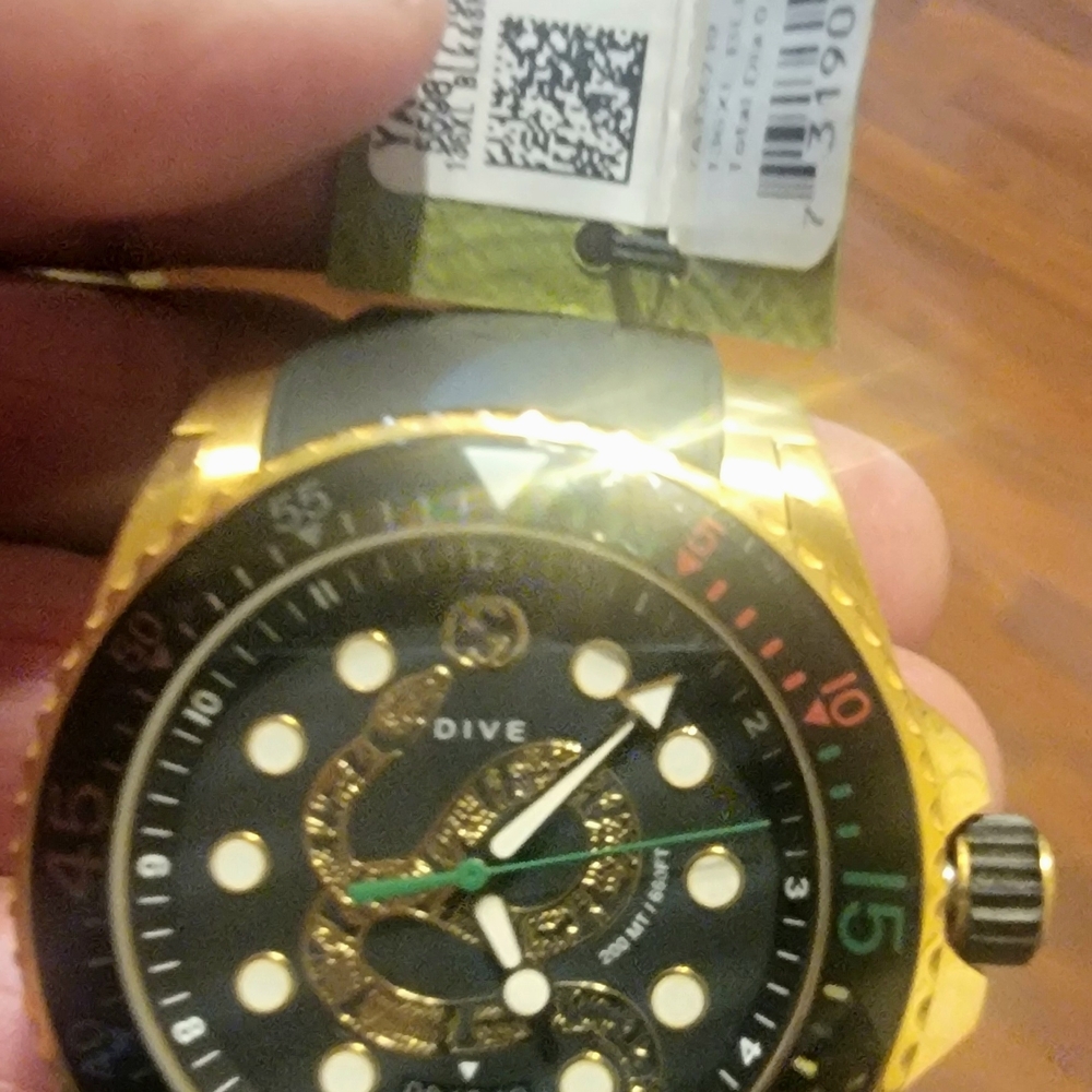 Authentic Gucci Gold and Black Watch with Snake Motif